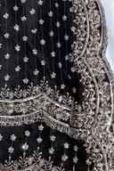 Black embroidered kurta, close up of the silver sequin border and scattered flower buti