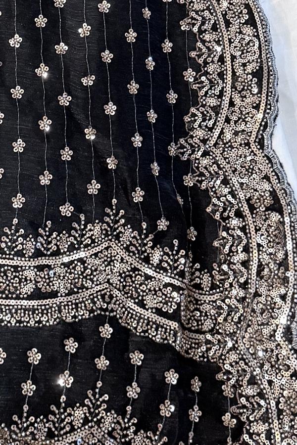 Black embroidered kurta, close up of the silver sequin border and scattered flower buti