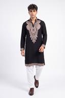 Black open neck kurta in motion, showing the gold embroidered hem band and cuffs