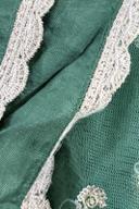 Green net dupatta, close up of the white embroidered scalloped border