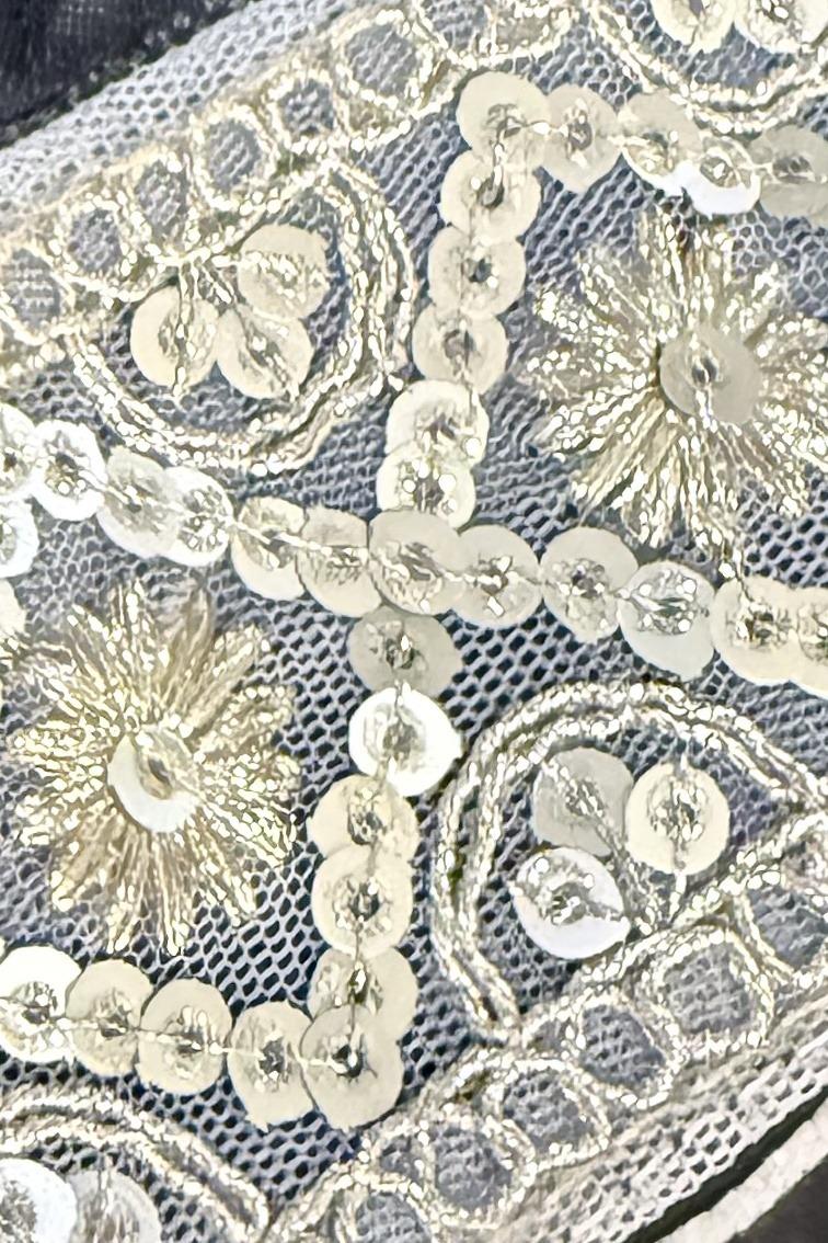 Farshi lehenga, close up of the ivory and gold sequin sunburst embroidery on net