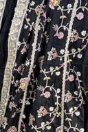 Black long frock, close up of the multicolor thread flower vines and silver borders
