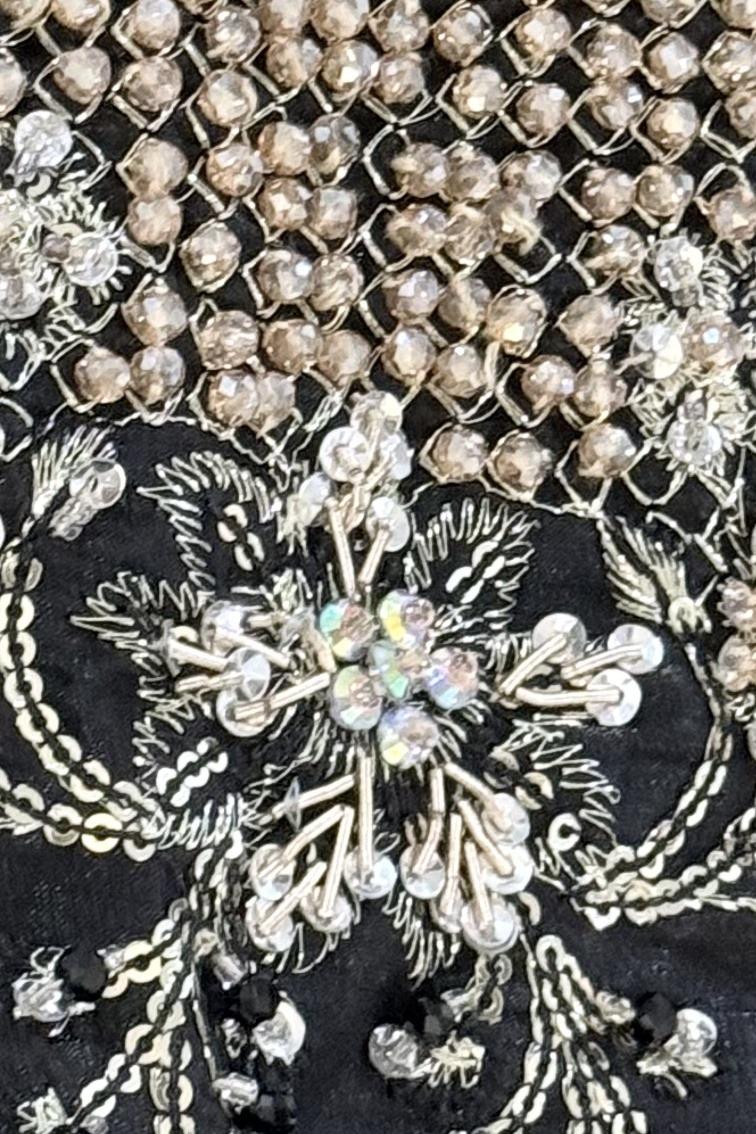 Black dupatta, close up of silver pearl lattice and a crystal sequin flower