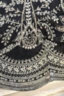 Black long shirt, close up of the full silver thread and sequin embroidery on the front