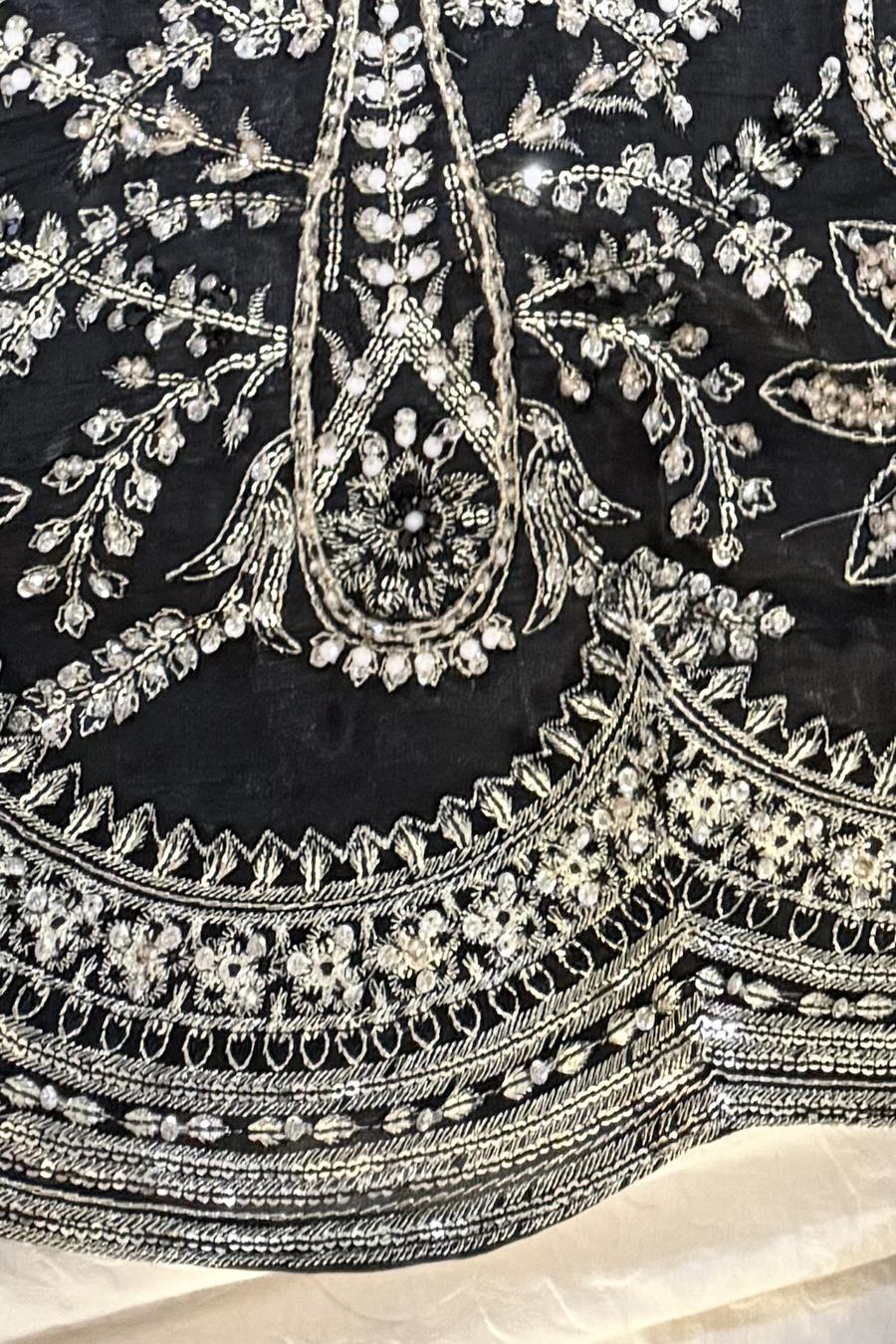 Black long shirt, close up of the full silver thread and sequin embroidery on the front