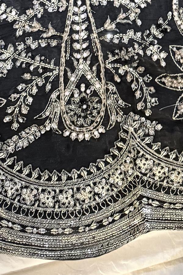 Black long shirt, close up of the full silver thread and sequin embroidery on the front