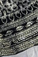 Black long shirt, close up of diagonal silver thread bands and sequin flowers