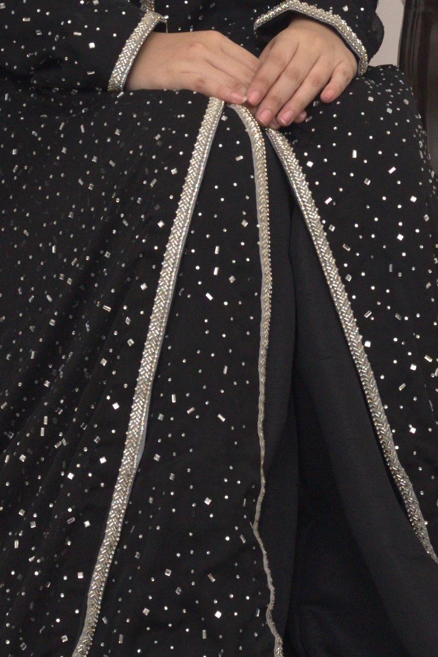 Black shimmer shirt, close up of the scattered sequins and silver piping