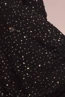 Black shimmer shirt, close up of the scattered sequins on the sleeve