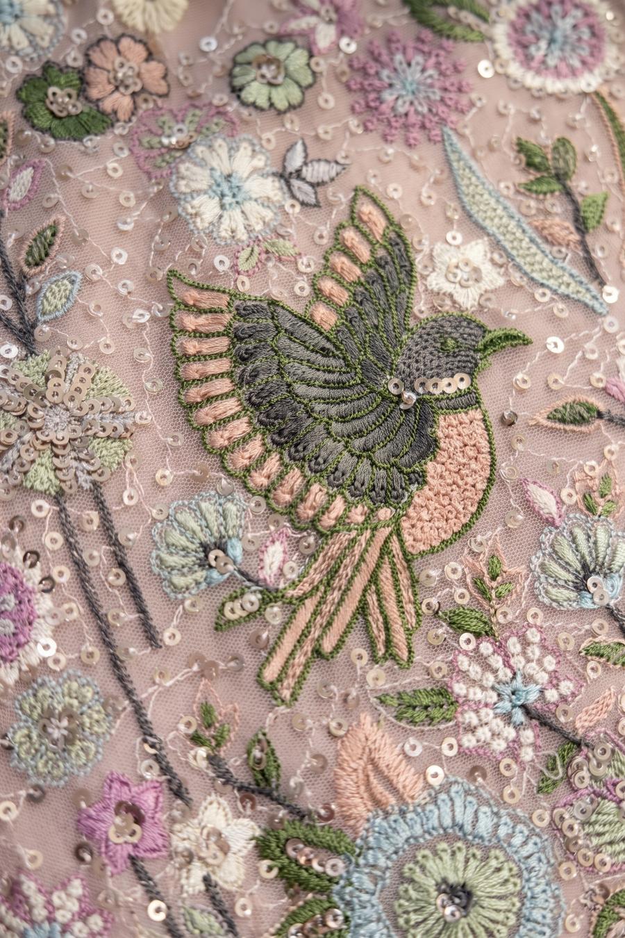 Close up of the blush pink kurta embroidery: perched birds, leaves and florals with flat sequins