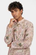 Blush pink net kurta, waist up, closed mandarin collar and all-over floral and bird embroidery