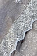 Champagne peplum, close up of the scalloped silver sequin hem with bead flowers