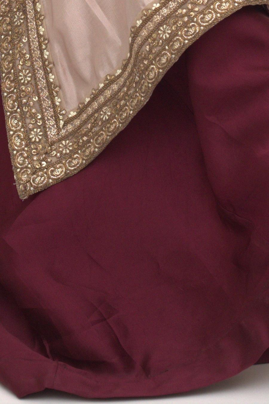 Champagne long shirt, close up of the gold embroidered neckline border on maroon