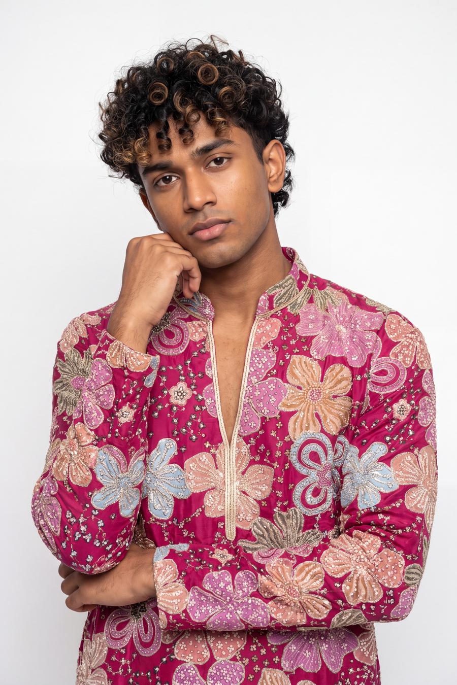 Fuchsia silk kurta, waist up, open collar with cream and gold cord and gold outlined florals