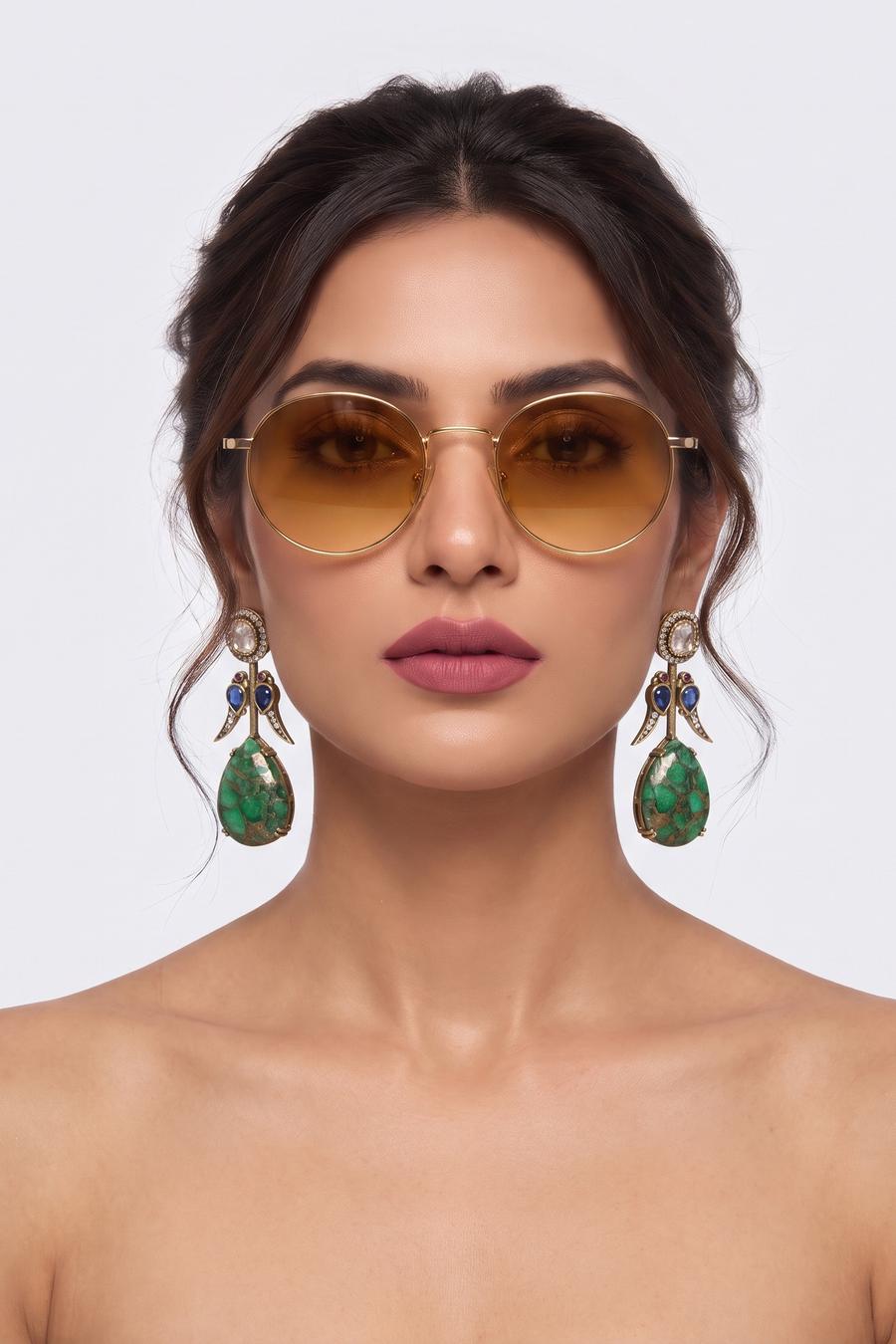 Model wearing Wear Wali emerald and sapphire Victorian drop earrings with a green mosaic stone teardrop