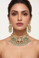 Model wearing the Wear Wali pistachio bead and kundan choker set in antique gold, with matching drop earrings