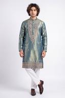 Two tone green tissue silk kurta with white shalwar, full length front view on a model