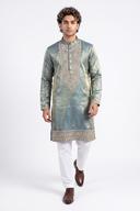 Green tissue silk kurta in motion, showing the teal to gold green sheen and side slits
