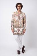 Ivory embroidered patchwork kurta with white shalwar, full length front view on a model
