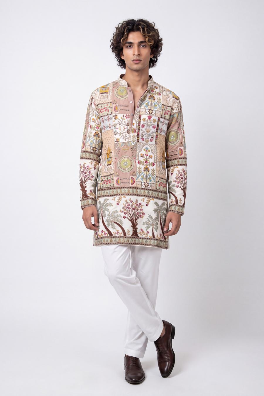 Ivory embroidered patchwork kurta with white shalwar, full length front view on a model