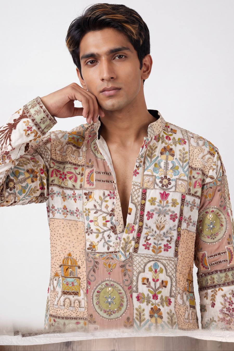 Ivory patchwork kurta, waist up, open collar with silver lattice and pearl buttons on a blush placket