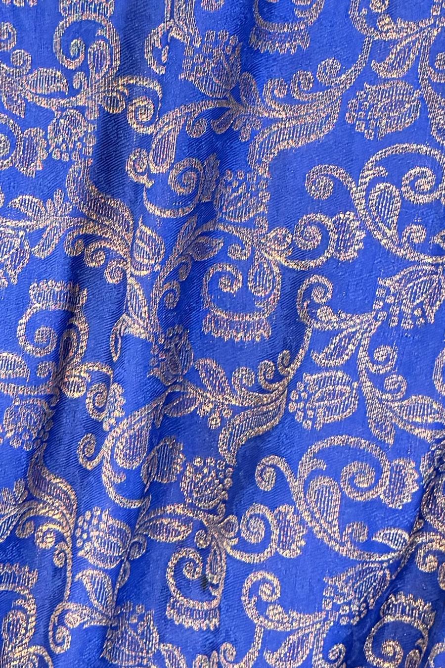 Blue brocade, close up of the gold woven paisley and floral scroll pattern
