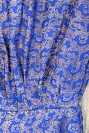 Blue brocade shalwar, close up of the gold woven floral scroll pattern