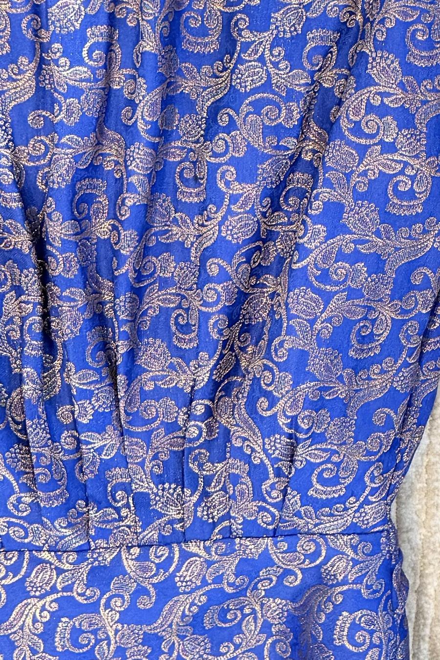 Blue brocade shalwar, close up of the gold woven floral scroll pattern