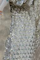 Ivory sequin lehenga set, close up of the sequin lattice shirt beside the dupatta border