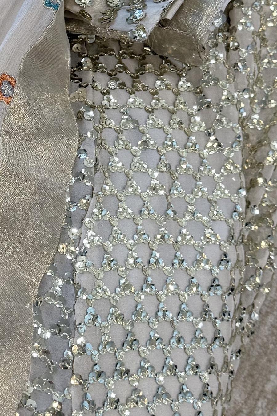 Ivory sequin lehenga set, close up of the sequin lattice shirt beside the dupatta border