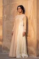 Ivory two tone gown with a pleated side panel and lace cuffs, full length side view