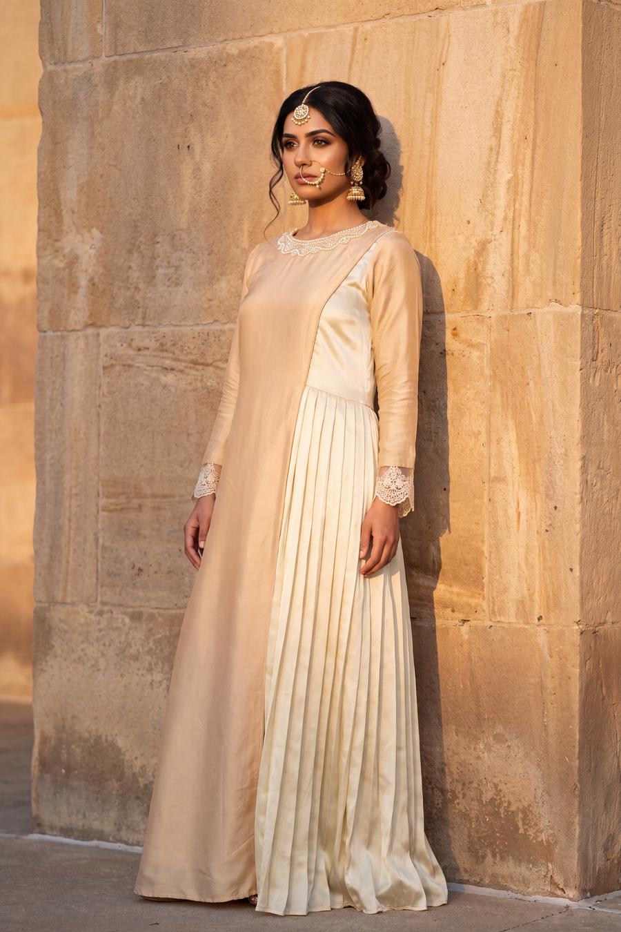 Ivory two tone gown with a pleated side panel and lace cuffs, full length side view