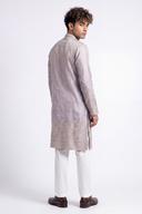 Back view of the lavender grey kurta with its deep silver paisley hem border and matching cuffs