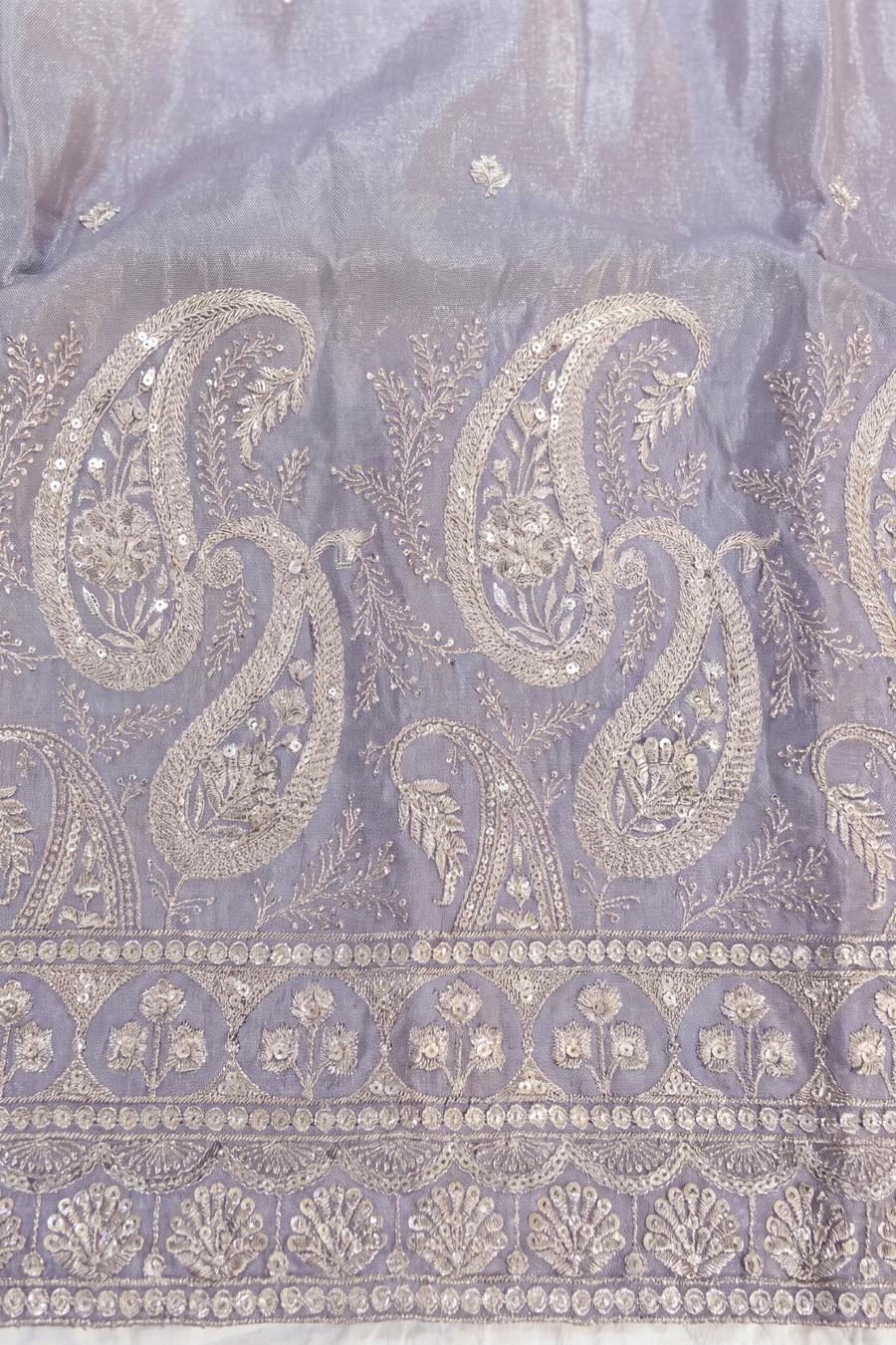 Close up of the lavender kurta hem: silver paisley, arched niches and palmettes with sequin lines