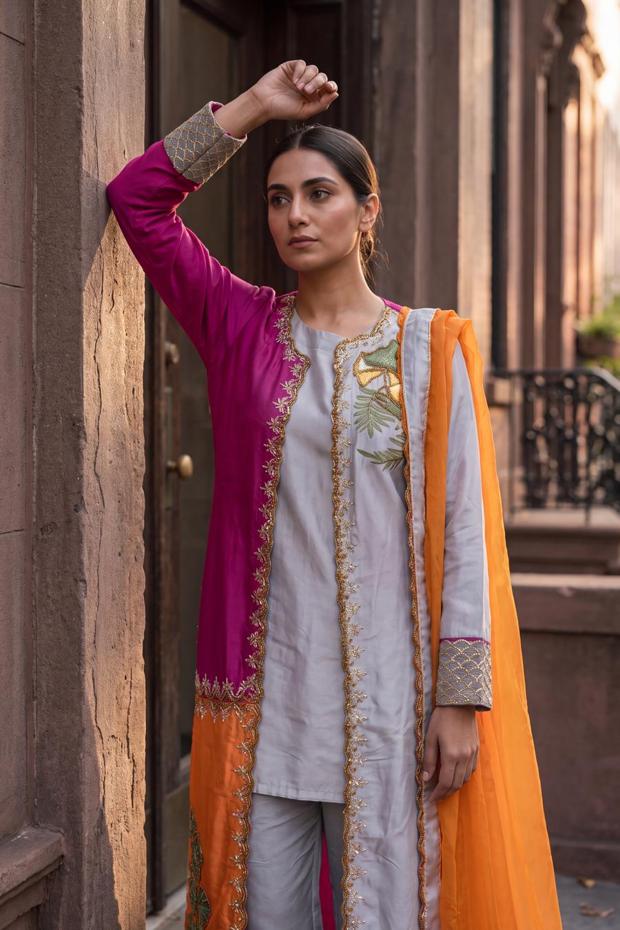 Magenta and silver gray two tone coat set with gold embroidered cuffs and orange dupatta, three quarter view