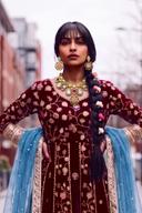 Maroon and gold anarkali with blue organza dupatta, waist-up front view with kundan necklace