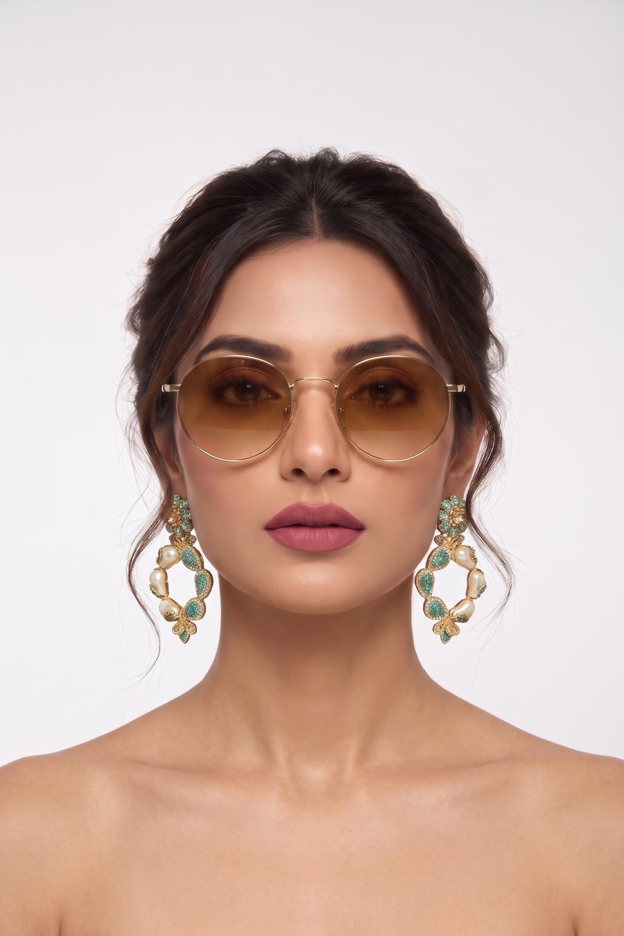 Model wearing Wear Wali floral hoop earrings in gold, alternating baroque pearls with mint pave teardrops