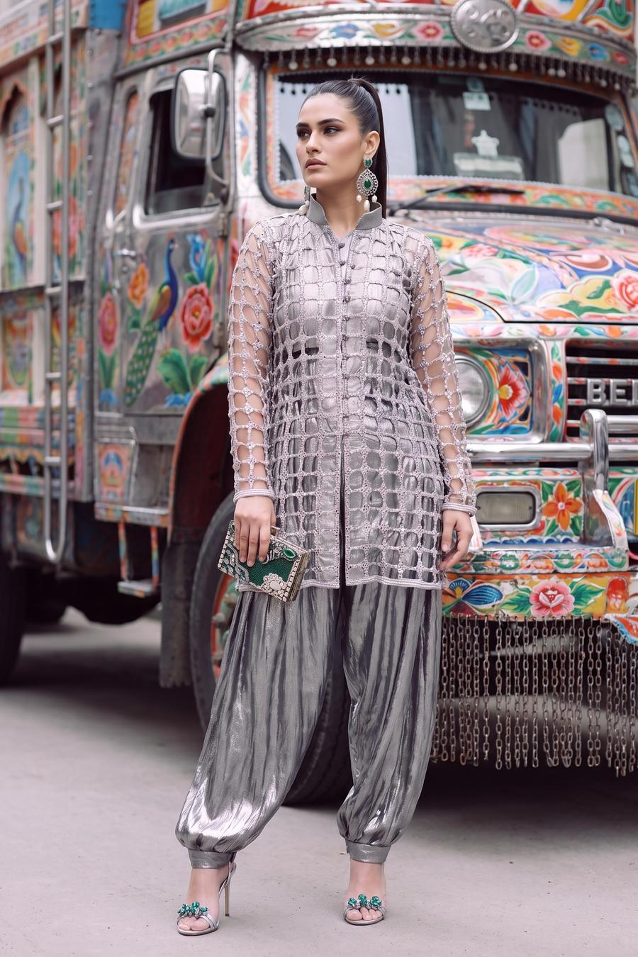 Silver jaali net jacket over velvet inner with metallic silver balloon pants, full length front view