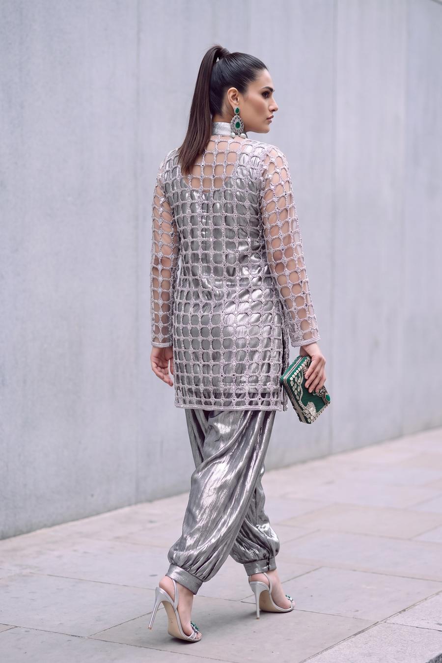 Back view of silver jaali net jacket and gathered metallic balloon pants with cuffed ankles