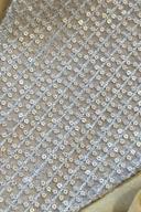 Mustard long shirt, close up of the silver sequin and thread grid work on sheer fabric