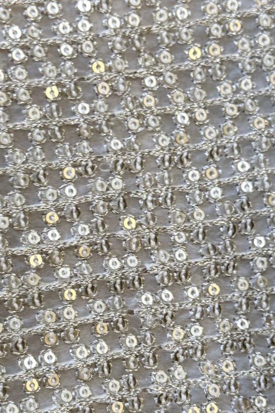Mustard long shirt, close up of the dense silver sequin lattice embroidery