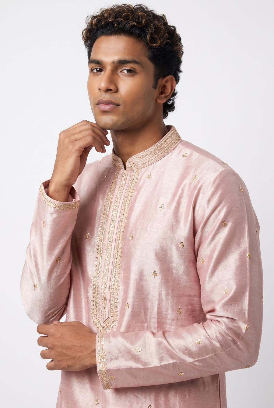 Detail of the pink tissue two tone men's kurta, showing the gold embroidered placket and collar band on the model