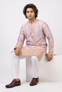 Pink tissue two tone men's kurta with gold embroidery, worn by a model in an editorial full length frame