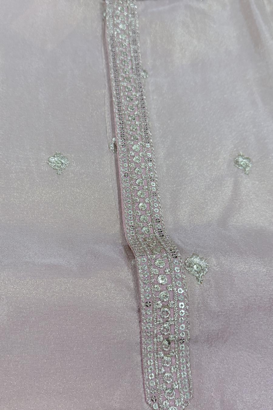 Macro close up of the embroidered cuff on the pink tissue two tone men's kurta