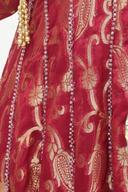 Red banarasi long shirt, close up of the gold paisley weave and beaded panel lines