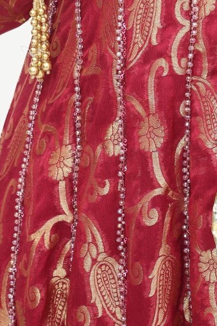 Red banarasi long shirt, close up of the gold paisley weave and beaded panel lines
