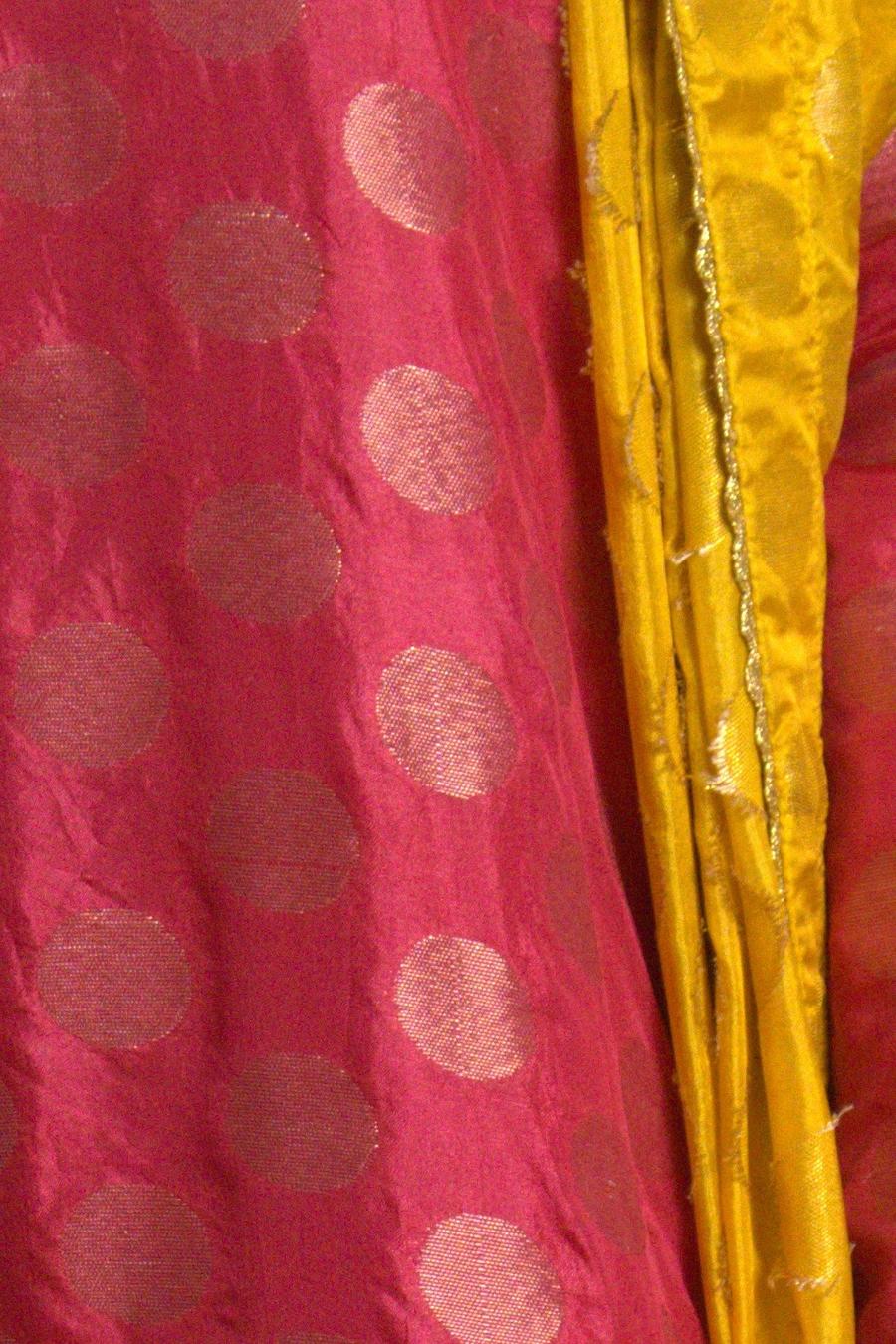 Red gold dot long shirt, close up of the woven gold dot pattern and mustard dupatta edge