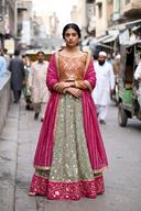Sage floral lehenga with tangerine sequin top and striped magenta dupatta, full length front view