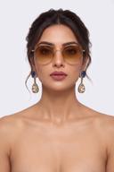 Model wearing Wear Wali sapphire blue Victorian drop earrings in antique gold, with a clear polki teardrop