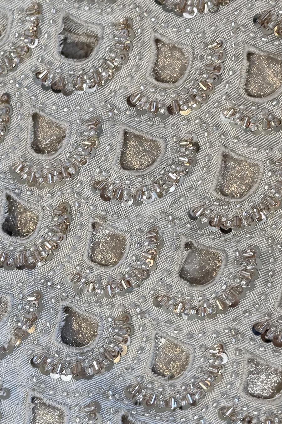 Silver mirror cutwork shirt, close up of scalloped cutwork outlined in silver sequins